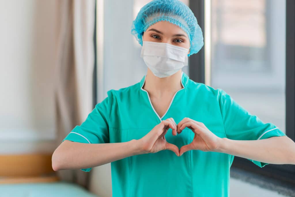 Nurse,With,Hands,Heart,Shape Nurse,With,Hands,Heart,Shape
